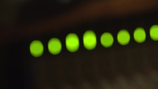 Bokeh lights of closeup of a solid-state logic in a recording studio with bokeh lights