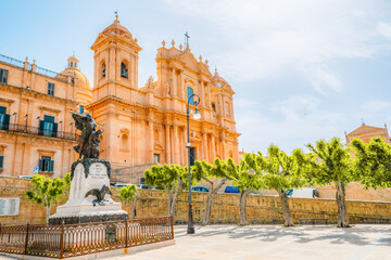 view in Noto, with the Basilica Minore di San Nicolo and Palazzo Ducezio, Sicily, Italy.