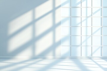 A bright, minimalist interior showcasing soft shadows cast by large windows. The calm ambiance and clean lines create a serene space, perfect for modern design aesthetics.