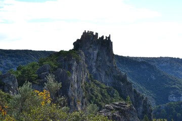 Scenic rocky cliff formation against a blue sky backdrop