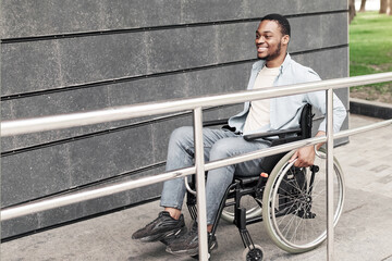Accessible environment for people with special needs concept. Positive young black man in...