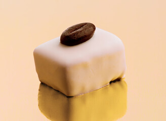 Delicious handcrafted dessert featuring creamy texture and coffee bean topping on a reflective surface