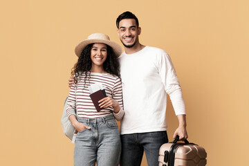 Happy Middle Eastern Spouses With Travel Tickets And Luggage Posing Over Yellow Background,...