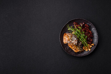 Grilled mackerel fillet pieces with vegetables, salt and spices