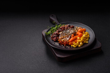 Grilled mackerel fillet pieces with vegetables, salt and spices