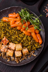 Quinoa bowl with tofu, steamed vegetables, grains, seeds and spices