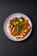 Quinoa bowl with tofu, steamed vegetables, grains, seeds and spices