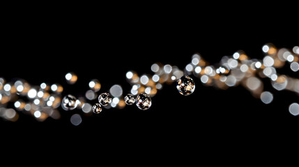 Tiny suspended droplets colliding in mid-air creating a sparkling chain reaction in zero gravity.
