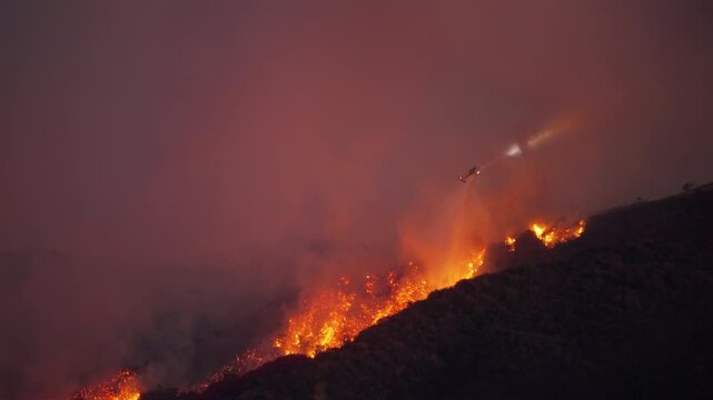 Stunning aerial footage vividly depicts helicopters battling massive fire in Malibu, Los Angeles, underscoring the ongoing and persistent struggles with devastating wildfires in January 7, 8, 9, 2025