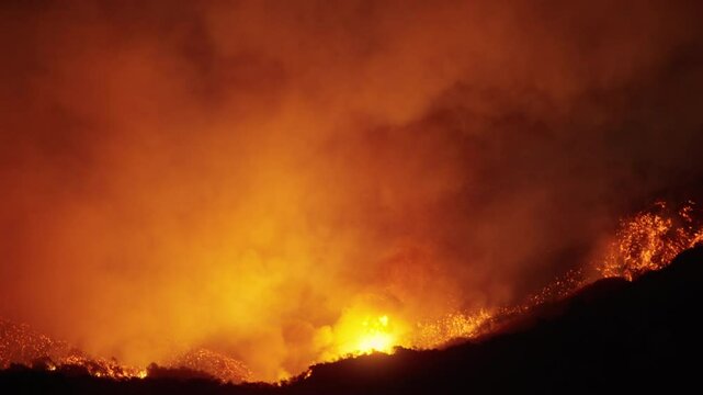 A dramatic scene of a wildfire in Malibu, Los Angeles, January 7, 8, 9, 2025, with helicopters battling the flames captured, showcasing the urgency and scale of the disaster.