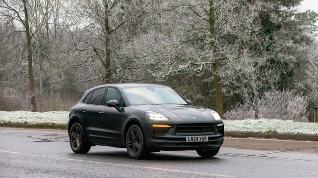 Milton Keynes,UK - Jan 12th 2025:  2024 Porsche Macan suv  car driving on a cold,frosty morning