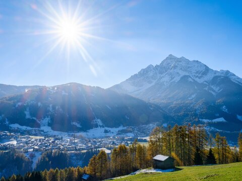 Mount Serles backlighted. Autumn at the Telfer Wiesen in the valley Stubai. Austria, Tyrol