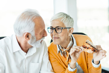 business meeting businesswoman woman office senior elderly businessman break pizza eating food man meal lunch friend friendship snack happiness fast italian hungry tasty teamwork