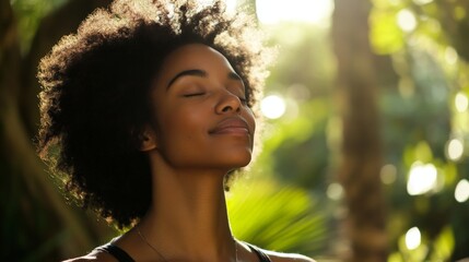Serene african female enjoying nature in sunlit forest