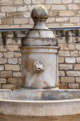 Aigues-Mortes, Gard, Occitania, France. Ancient drinking water fountain.