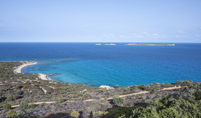 Aerial view of the small beaches on the coast of Castiadas in Sardinia with transparent, blue and turquoise water