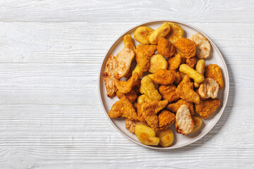 fried chunks, bites, tenders, nuggets on a plate