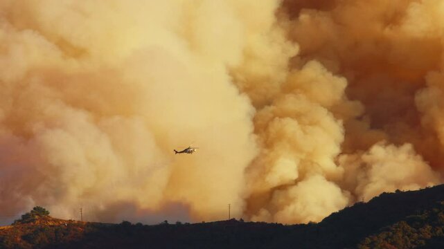 A chaotic fire is raging in Malibu, Los Angeles, with aircraft battling the flames, capturing dramatic footage in 4K, showcasing the intensity and heroic efforts. January 7, 8, 9, 2025