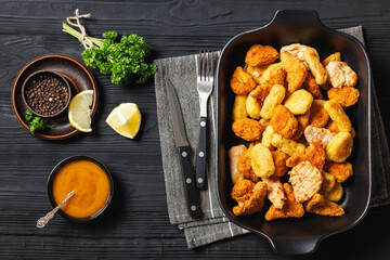 fried chunks, bites, tenders, nuggets on a dish