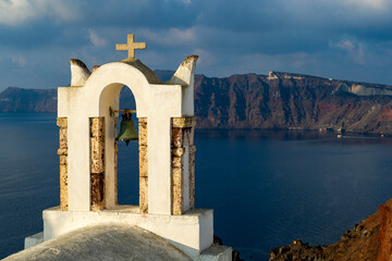 Greece, Santorini, Oia. View of church rooftops overlooking the Aegean Sea.