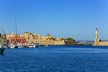Chania, Crete, Greece. Old town walled city and harbor with lighthouse and boat marina