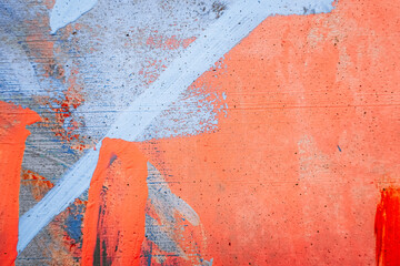 Messy paint strokes and smudges on an old painted wall background. Light blue, purple, white drips,...