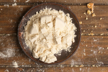 plate with protein powder on light background