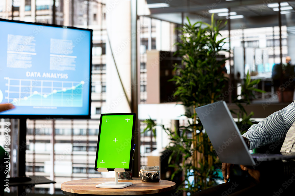 Poster green screen tablet next to manager in office implementing business strategies to improve operationa