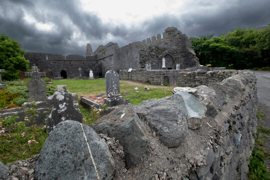 Stone wall surrounds the graveyard at ancient Murrisk Abbey.