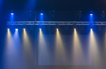 Stage lighting fixtures, blue, purple and white lighting.