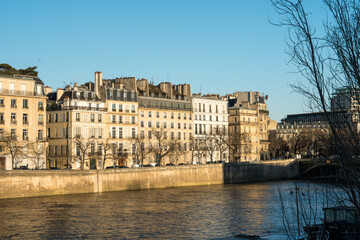Beautiful riverside view of historic Parisian architecture during sunset
