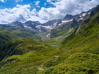 Fototapeta premium Valley Seeber Tal view towards Mt. Hochfirst and Mt. Granatenkogel in the Nature Park Texelgruppe in the Passeier Valley in the Otztal Alps. Italy, South Tyrol
