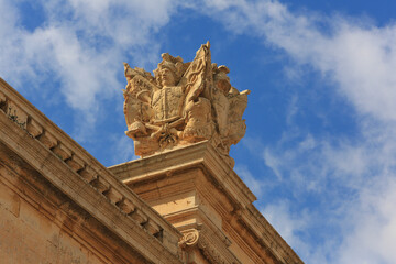Mdina, Malta. Limestone knights coat of arms on ancient limestone roof