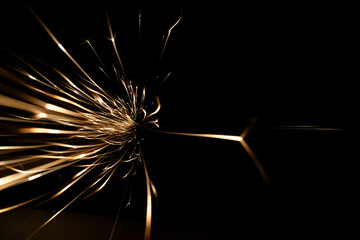 sparks from the grinder glowing in the dark