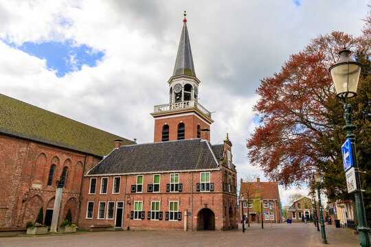 Netherlands, Groningen, Appingedam. Raadhuis. City Hall. Side wall, seen from the East, with the Tower of Nicolai Church.