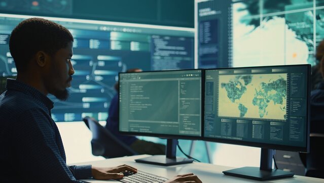 Cyber security experts team working on encryption and IT security in a governmental agency. Specialists working on cyber operations, network security and data protection for national safety. Camera B.