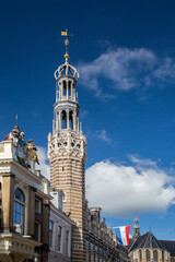 Obraz premium The tower of the early 16th century Alkmaar City Hall (Stadhuis) built in Gothic style at Langestraat, Center of Alkmaar.