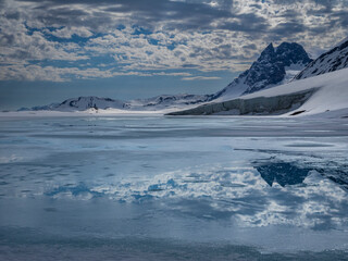 Svalbard, Norway. Landscape of mountain, glacier and water.