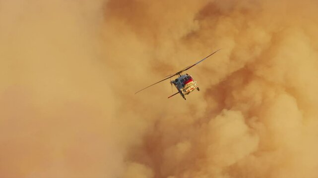 Helicopters bravely battle a fierce Malibu fire in stunning slow motion, showcasing the ongoing wildfire crisis of January 7, 8, 9, 2025 and the urgent need for effective firefighting tactics