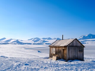 Traditional hut at frozen Gronfjorden, Island of Spitsbergen. Arctic region, Scandinavia, Norway,...