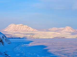 Glacier Nordenskioldbreen and frozen Billefjorden. Winter landscape on the island Spitsbergen in the Svalbard Archipelago. Scandinavia, Norway.