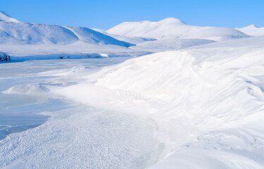 Frozen river. Valley Reindalen during winter, Van Mijenfjorden National Park, on the island of Spitsbergen in the Svalbard Archipelago. Arctic, Norway. © Danita Delimont