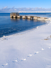 Ruins of Russian mining town. Coast of Colesbukta part of Isfjorden during winter, on the island of Spitsbergen in the Svalbard Archipelago. Arctic, Norway.
