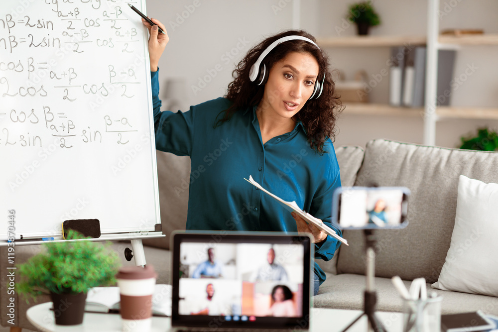 Poster e-learning, online life. confident tutor in wireless headphones having videocall conference with stu