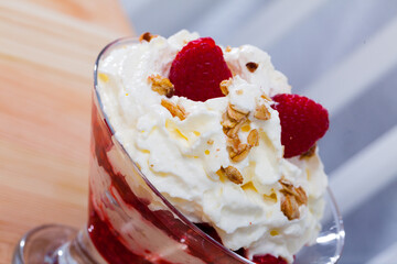 Cranahan - tasty Scottish dessert of whipped cream and fried oat flakes with whiskey, honey and raspberries