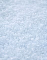 Obraz premium Snow in winter close-up. Macro image of snowflakes, winter background. Nice background on the theme of winter, christmas, new year. Frost Winter texture iced surface. isolated with white highlights