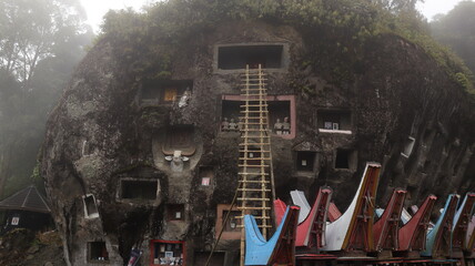 Coffins and graves are placed inside rocks. This is a tradition used as a burial place for the...