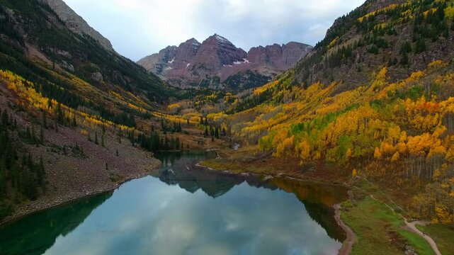 Aerial Backward Reflection Of Famous Mountain Peaks In Lake In Tranquil National Park - CO, 
Colorado Springs, United States of America