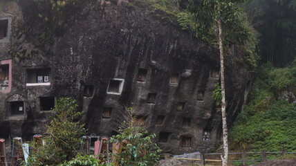 Coffins and graves are placed inside rocks. This is a tradition used as a burial place for the...