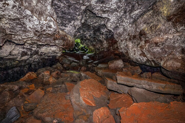 Seen from inside one of the entrances, the Kauamana Caves lava tube was formed on the Big Island of Hawaii during an 1881 lava flow of the Mauna Loa volcano.